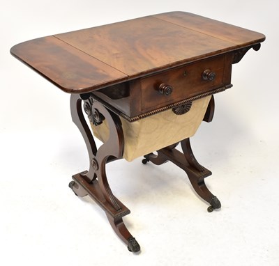 Lot 20 - A 19th century mahogany workbox with drop-leaf...
