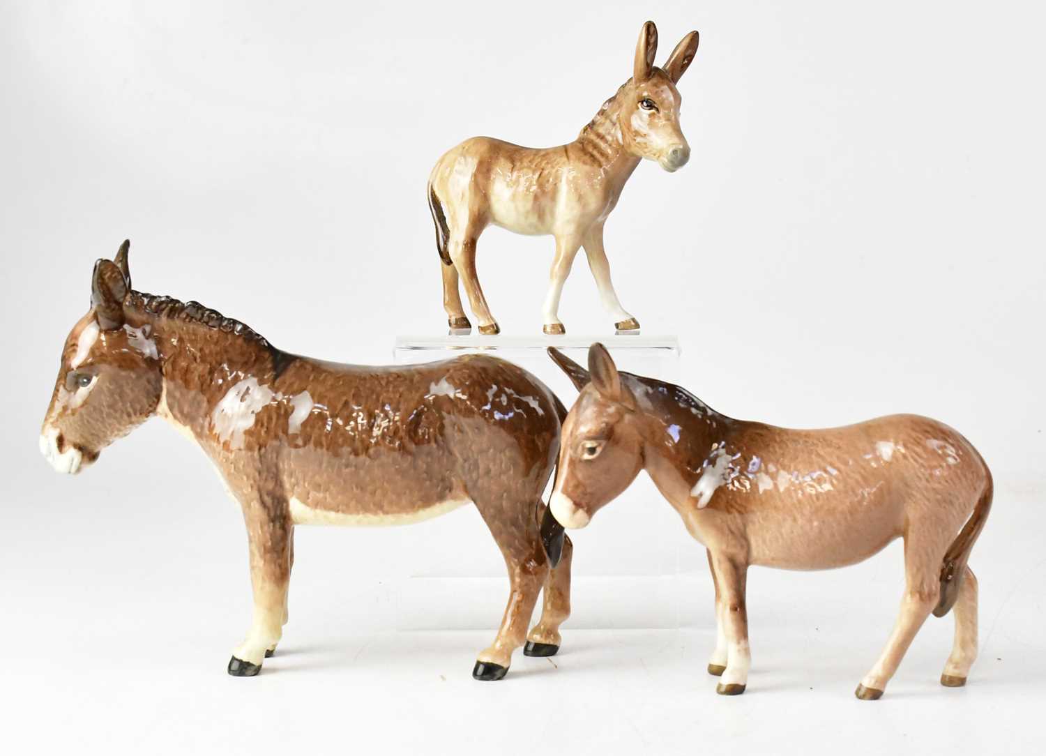 Lot 382 - BESWICK; three donkeys, height of largest 14cm...