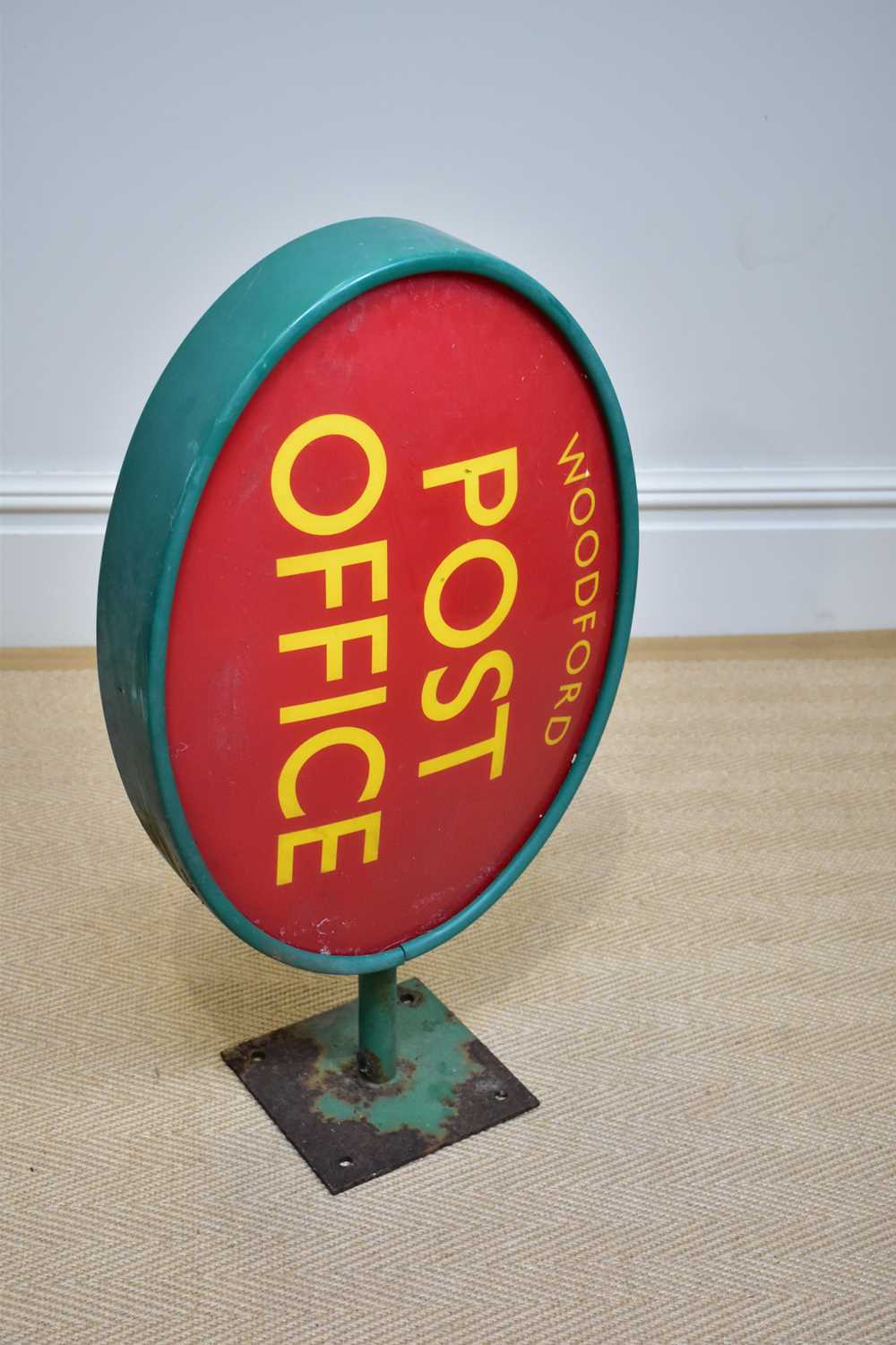 Lot 1284 - A green painted advertising post office sign...