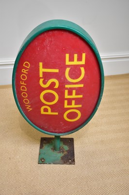 Lot 1284 - A green painted advertising post office sign...