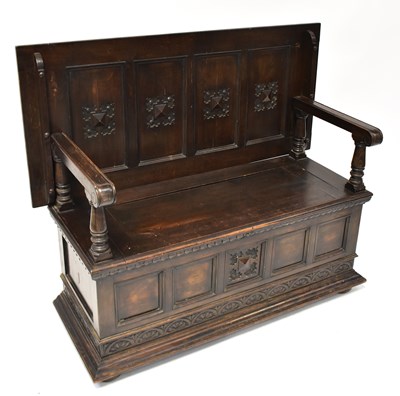 Lot 29 - An early 20th century oak monk's bench, the...