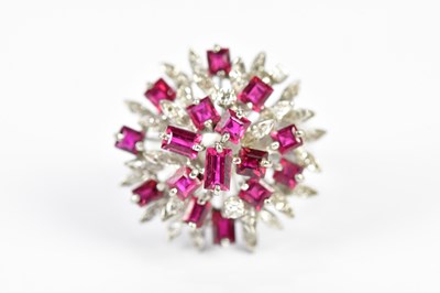 Lot 60 - A white metal diamond and ruby cocktail ring,...