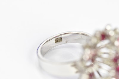 Lot 60 - A white metal diamond and ruby cocktail ring,...