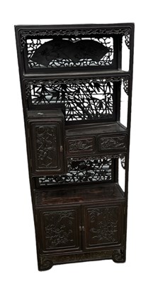 Lot 1003 - A Chinese carved hardwood and ebonised display...