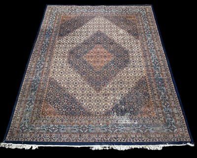 Lot 127 - A large Persian rug with geometric design, 400...