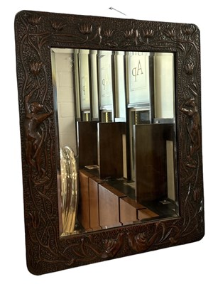 Lot 26 - An Arts and Crafts copper framed wall mirror...