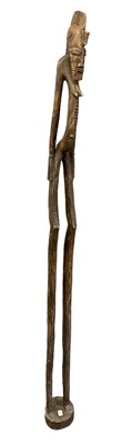 Lot 1233 - A large 20th century carved African standing...