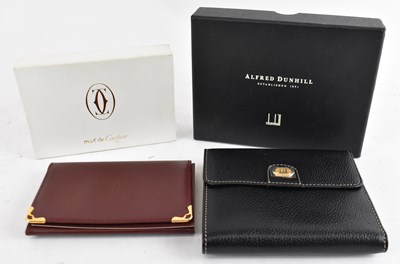 Lot 446 - ALFRED DUNHILL; a boxed leather purse with...