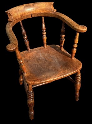Lot 64 - A smoker's bow back elbow chair.