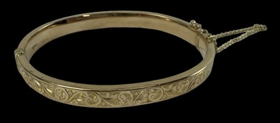 Lot 707 - A 9ct yellow gold bangle, diameter 5.5cm,...