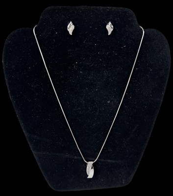 Lot 658 - An 18ct white gold necklace suspending an 18ct...