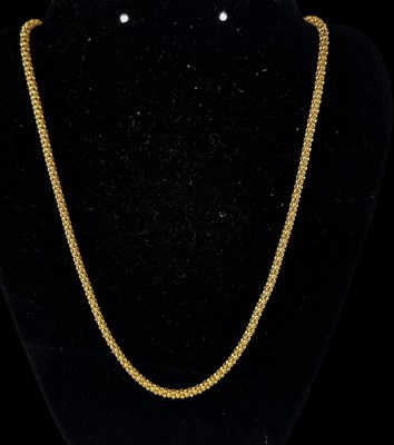 Lot 692 - A yellow metal necklace marked '916', length...