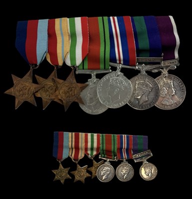 Lot 391 - A set of seven WWI and WWII medals, including...