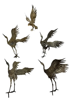 Lot 604 - A group of five white metal models of birds,...