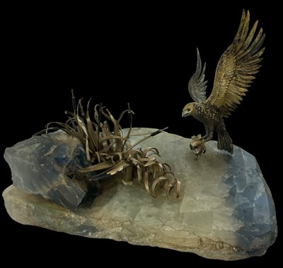 Lot 613 - A white metal model of an osprey with a fish...