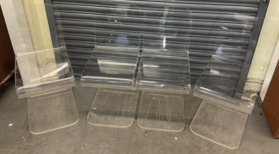Lot 18 - A set of four modern acrylic ghost type chairs.