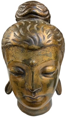 Lot 1028 - A modern bronze model of Buddha's head, height...