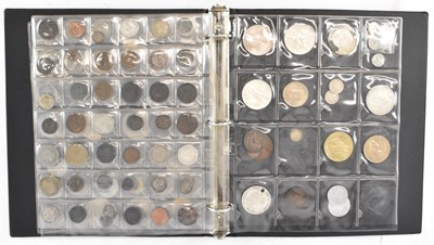 Lot 811 - An album of assorted all world coins, from...