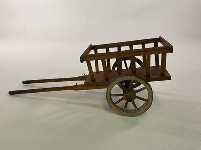 Lot 258 - A large scale toy wooden cart, length 40cm,...