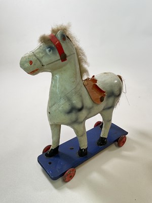 Lot 261 - A large scale white toy horse on blue platform...