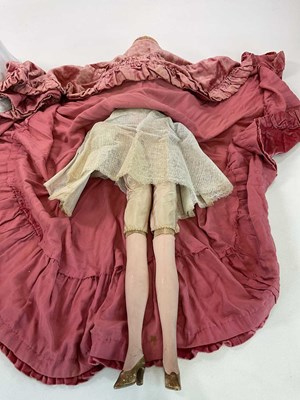 Lot 398 - A large French boudoir doll with velvet dress,...