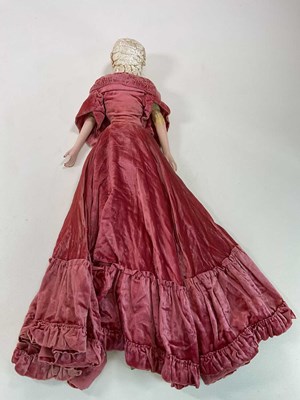 Lot 398 - A large French boudoir doll with velvet dress,...
