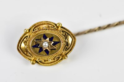 Lot 23 - A yellow metal pin, set with a central pearl.
