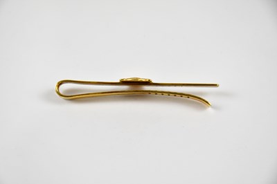 Lot 11 - A 9ct yellow gold tie clip with applied shell,...