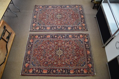 Lot 447 - An Eastern style rug with floral and stylised...