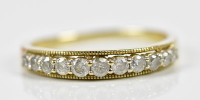 Lot 164 - A 9ct yellow gold diamond half eternity ring,...