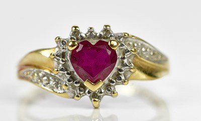 Lot 165 - A 9ct yellow gold diamond and ruby heart...