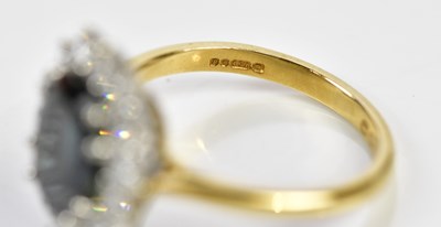 Lot 73 - An 18ct yellow gold sapphire and diamond oval...