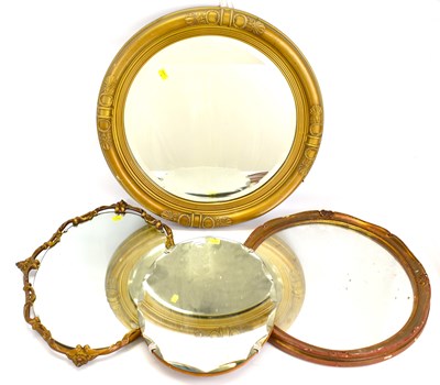 Lot 105 - Four wall mirrors, comprising an oval example...