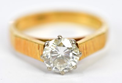 Lot 65 - An 18ct yellow gold diamond solitaire ring,...