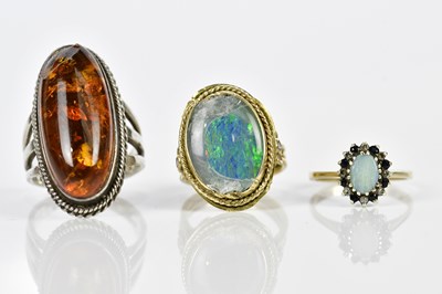 Lot 223 - A 9ct yellow gold opal dress ring, size K,...