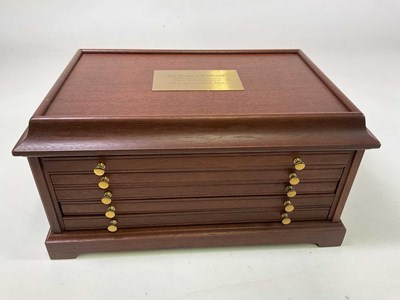 Lot 150 - A five drawer display cabinet bearing plaque...