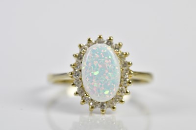 Lot 89 - A 14ct yellow gold simulated opal and diamond...