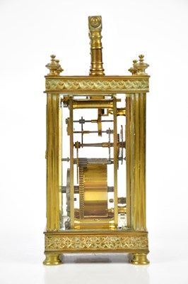 Lot 404 - A brass cased carriage clock, the white enamel...