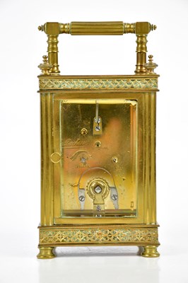 Lot 404 - A brass cased carriage clock, the white enamel...