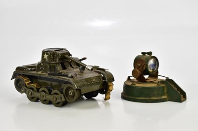 Lot 303 - A vintage tinplate tank and searchlight.