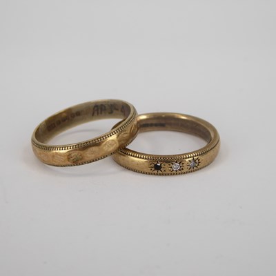 Lot 736 - Two 9ct gold wedding bands, one with three...