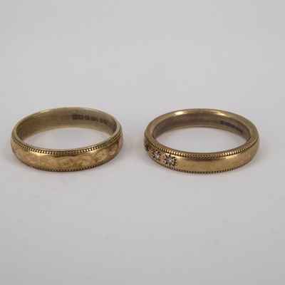 Lot 736 - Two 9ct gold wedding bands, one with three...