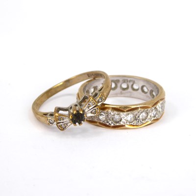 Lot 733 - A 9ct yellow and white gold eternity ring set...