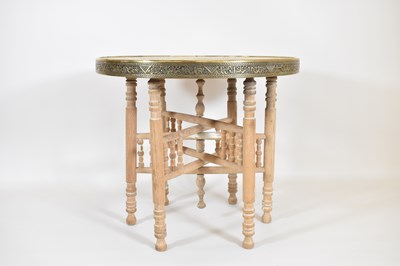 Lot 39 - An early 20th century brass tray-top table on...