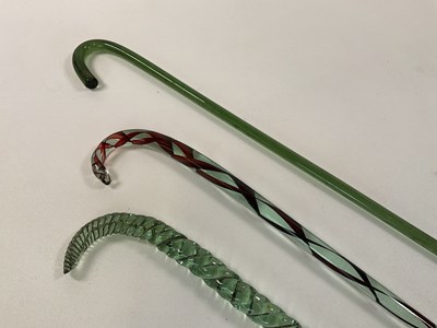 Lot 124 - Three Victorian Nailsea glass walking canes,...