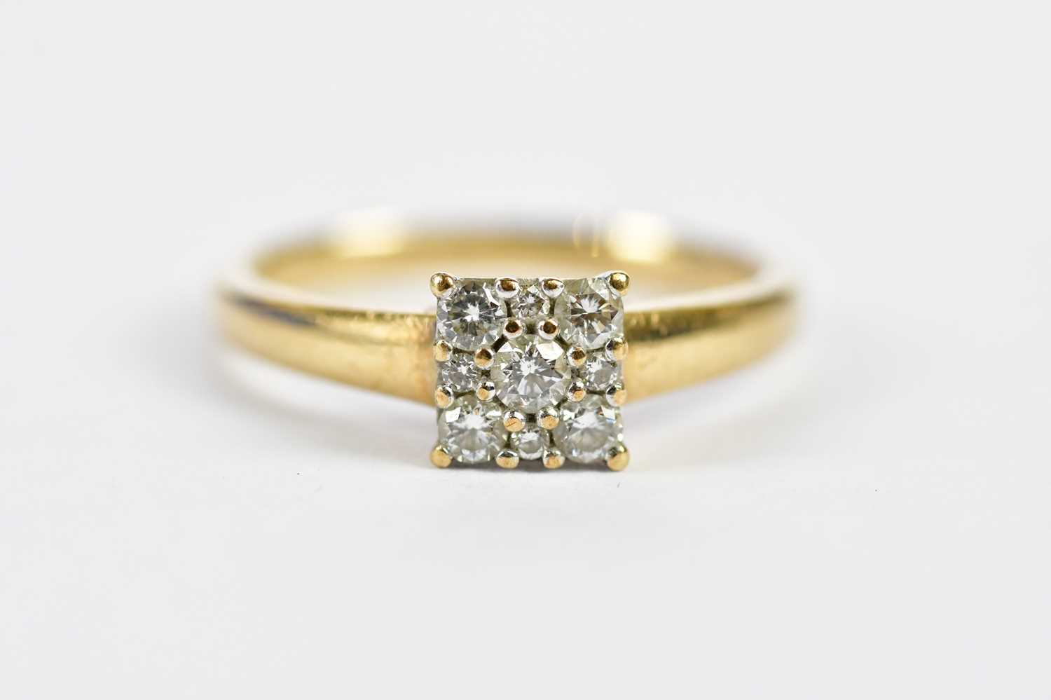 Lot 132 - A 9ct yellow gold nine stone diamond ring in