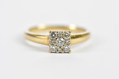 Lot 132 - A 9ct yellow gold nine stone diamond ring in...