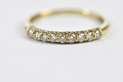 Lot 168 - A 9ct yellow gold half eternity ring, set with...