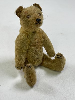 Lot 64 - A small vintage mohair Teddy bear with glass...
