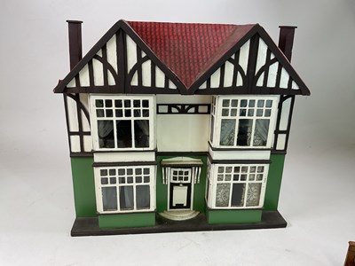 Lot 74 - A circa 1920s doll's house in half timber...